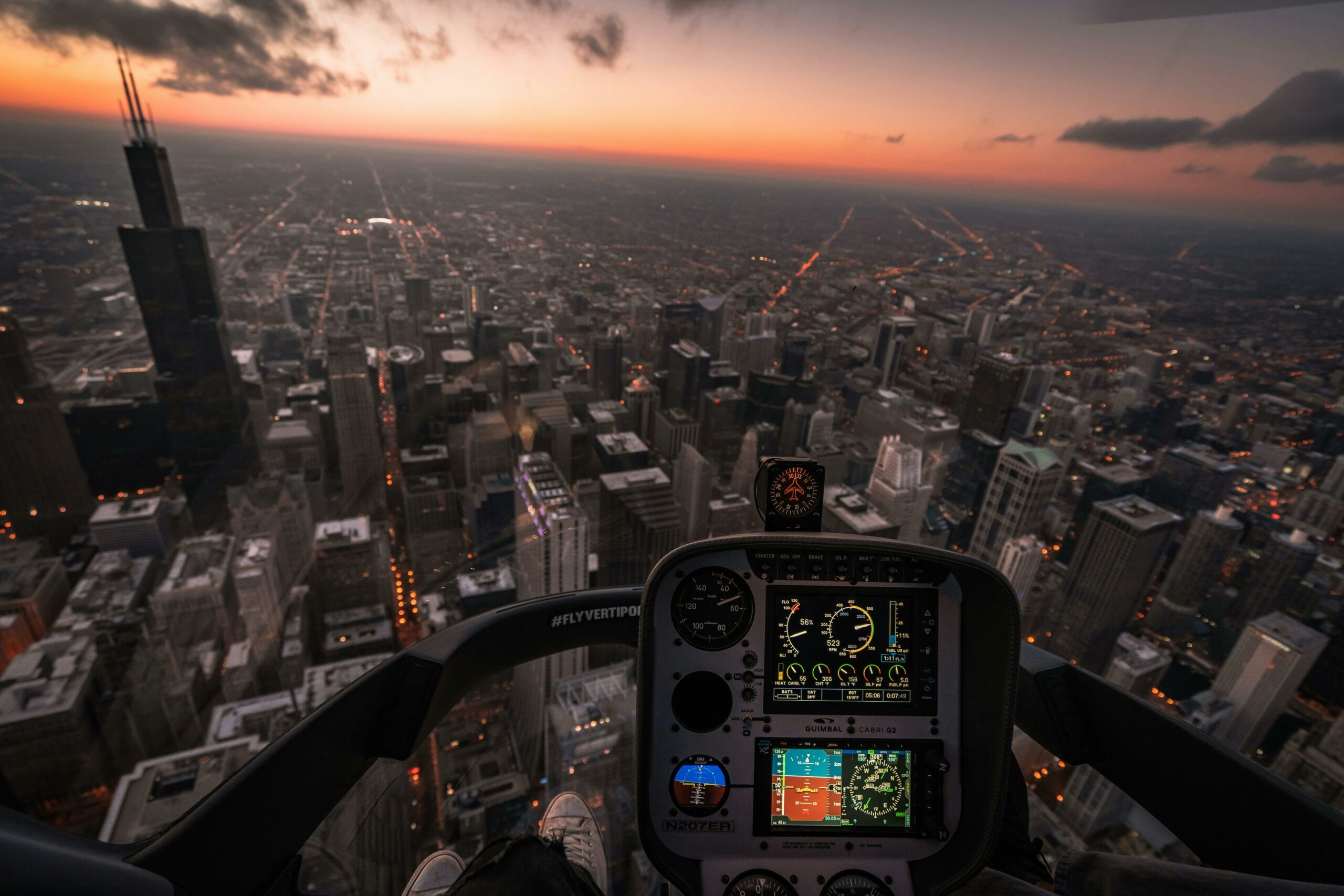 View of a city skyline through a plane cockpit.