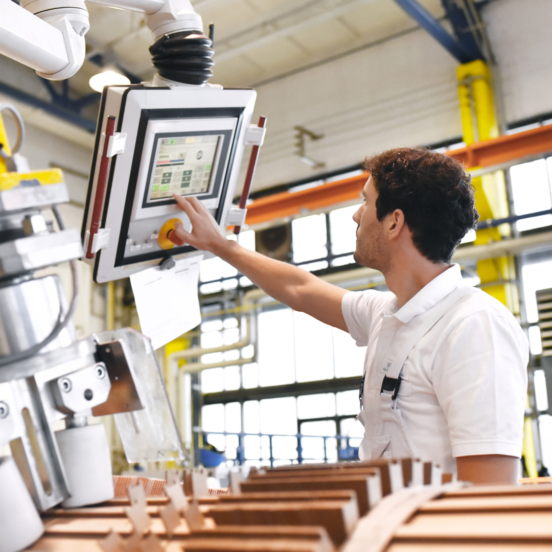Manufacturing engineer using computer-aided manufacturing software.