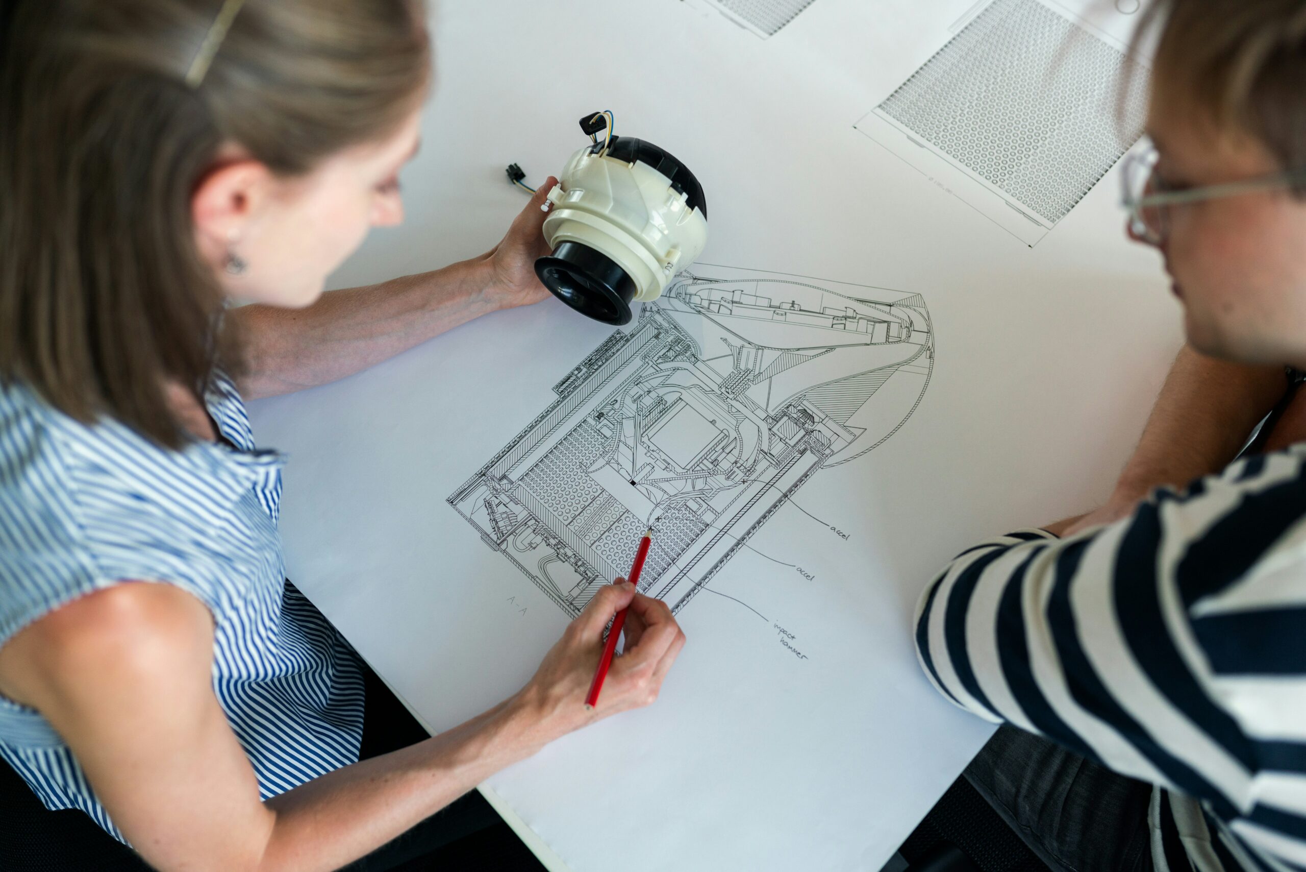 Noise and vibration mechanical engineer working on a design.
