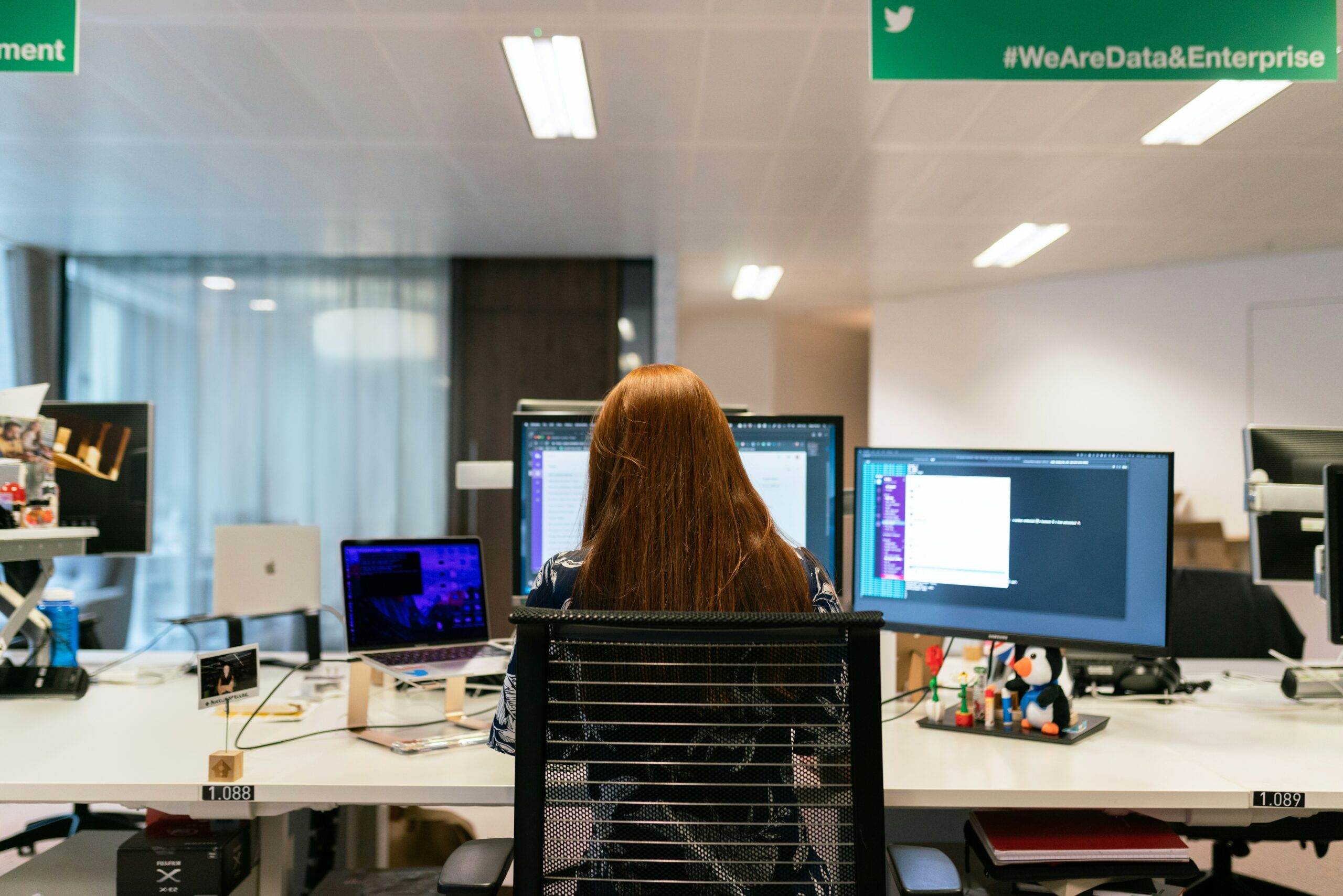 Female software engineer working at her desk.